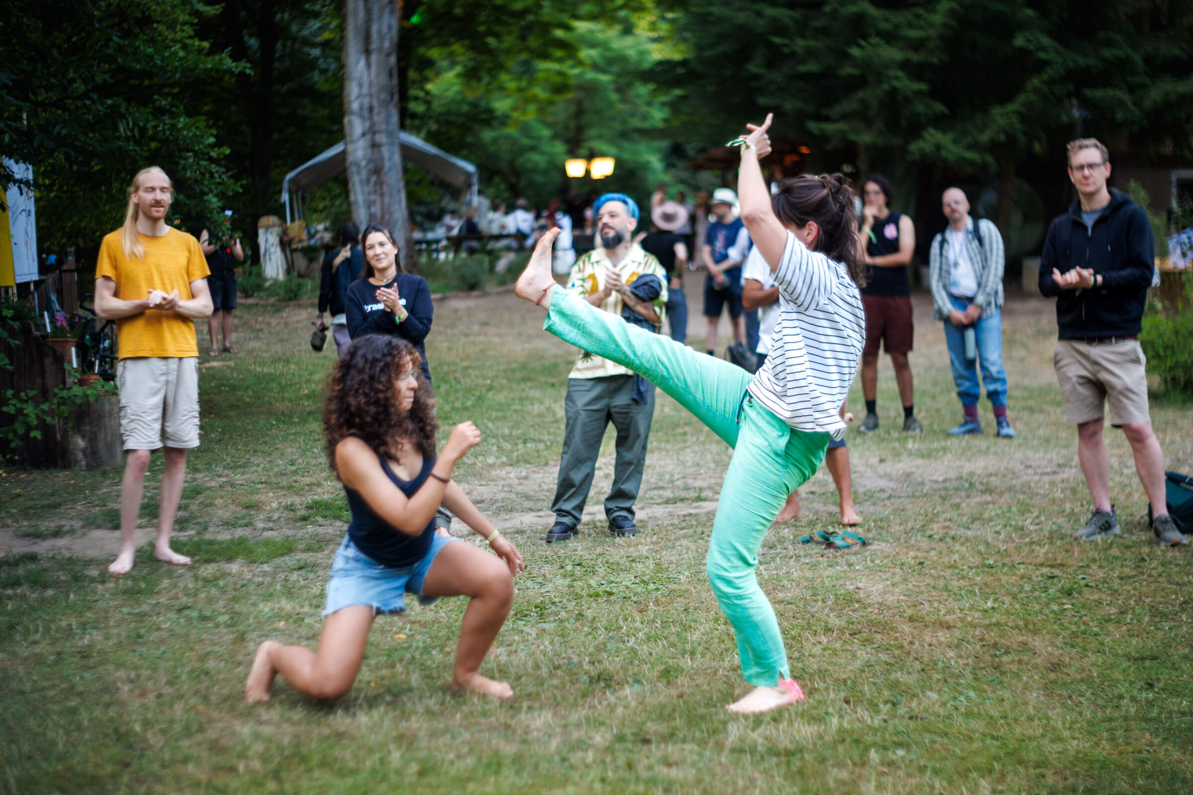Taking a capoeira break at DWeb Camp.  Capoeira is an Afro-Brazilian martial art that combines elements of fight, dance, acrobatics, and music.