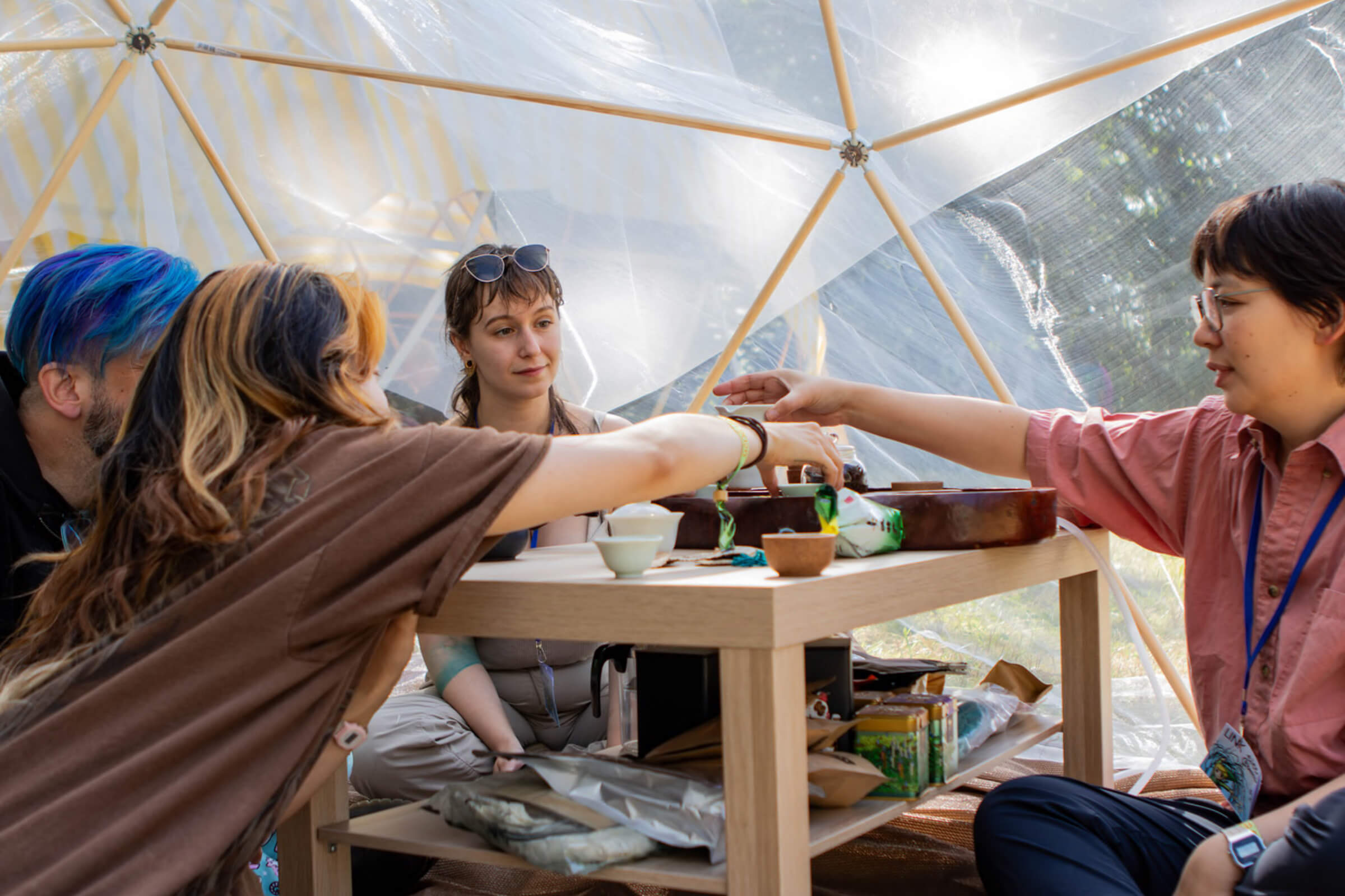 Eileen Wagner hosts an intimate tea tent with Zenna, Andre Garzia, and riley wong.